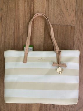 Large kate spade Cream/White Striped Tote with Tan leather Handles. Summer tote!